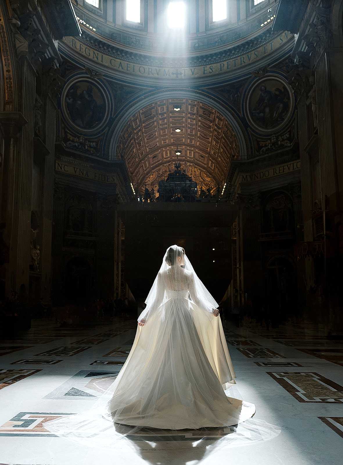 Phillipa_Lepley_Bride_Taylor_Bespoke_Vatican_Wedding_Dress_Duchess_Satin_Strapless_Gown_And_Lace_Long_Sleeve_Top_With_Embroidered_Script_Veil