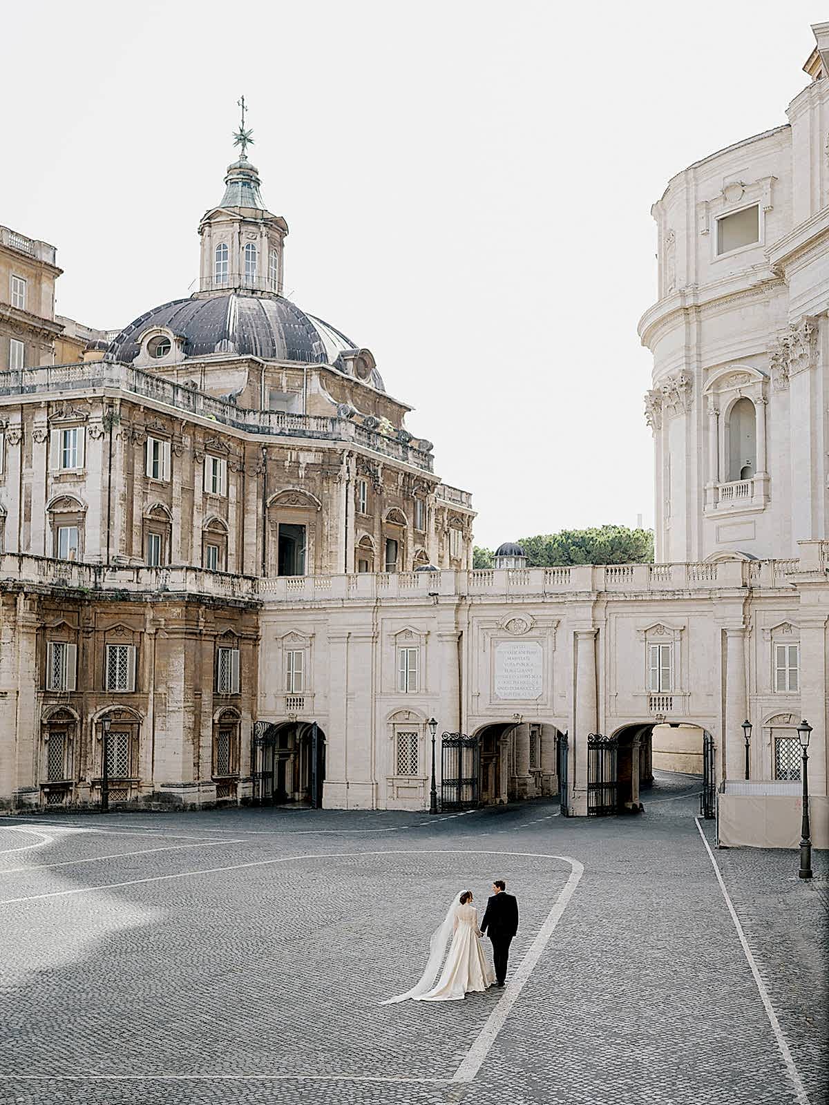 Phillipa_Lepley_Bride_Taylor_Bespoke_Vatican_Wedding_Dress_Duchess_Satin_Strapless_Gown_And_Lace_Long_Sleeve_Top_With_Embroidered_Script_Veil
