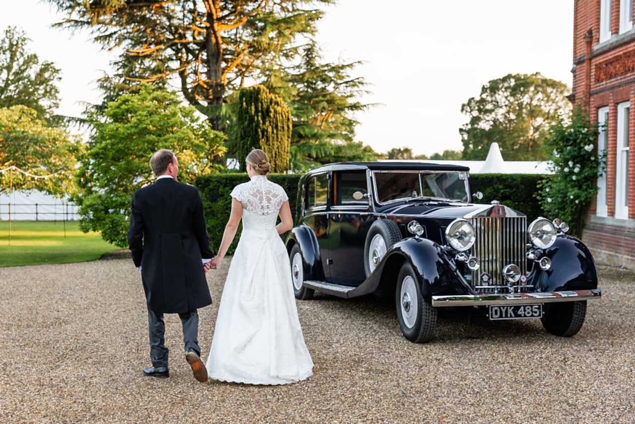 Phillipa_Lepley_bride_Amelia_Corseted_Couture_Scroll_Lace_Wedding_Dress_With_High_Neck_Lace_Border_Veil